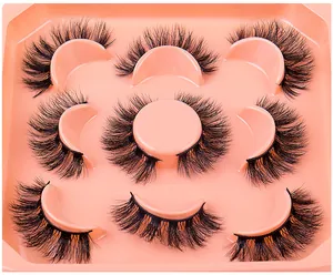 Detailed macro view of 7 pairs of thick faux mink eyelashes with fluffy layered design