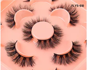 Macro shot of 5 pairs multi-layered curled faux mink eyelashes in model FLY5-010
