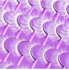 Macro shot of 20 pairs of white synthetic false eyelashes with fine fiber texture