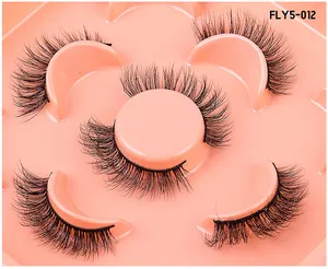 Detail of 5 pairs of 3D faux mink lashes on pink tray, style FLY5-012 with fluffy texture