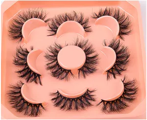 Close-up of 7 pairs of thick 3D faux mink eyelashes on a pink plastic display tray