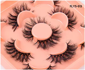 Detail of 5 pairs of voluminous faux mink eyelashes with criss-cross pattern in pink tray