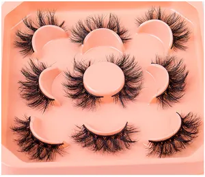Close-up of 7 pairs of 3D layered thick faux mink eyelashes in a beige tray display