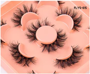 Detailed close-up of 5 pairs of fluffy 3D faux mink eyelashes in a pink tray