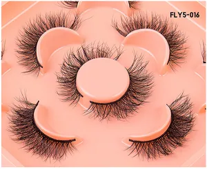 Close-up of 3D multi-layered faux mink eyelashes in model FLY5-016 on a pink tray