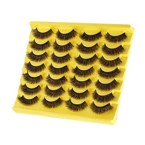 Set of 14 pairs of thick curly faux mink eyelashes in a bright yellow display tray