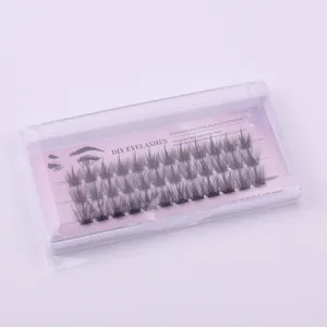 Detailed view of DIY individual eyelash extension clusters in purple packaging box