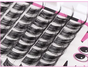 Detailed macro view of 604 clusters of black false eyelashes with natural curled texture
