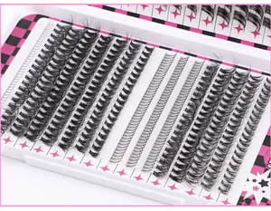 Macro shot of 604 black individual lash clusters neatly arranged in a patterned storage box