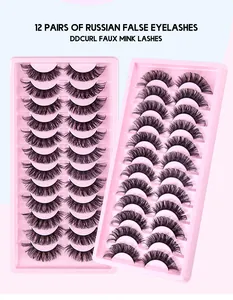 Detail view of 12 pairs of dense layered DD curl Russian faux mink lashes on pink trays