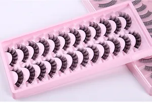 Detailed view of 12 pairs of thick Russian curl false eyelashes in a pink tray