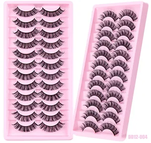 Detailed view of 12 pairs of dense black Russian curl faux mink eyelashes in a pink tray