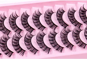 Detailed view of 12 pairs of dense Russian curl fake eyelashes on pink tray