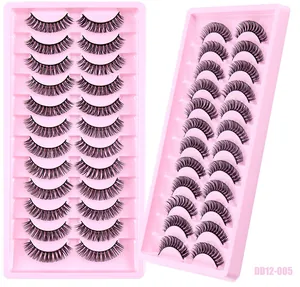 Detail view of DD curl Russian volume false eyelashes in 10-pair boxes on pink trays