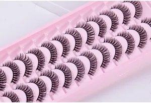 Close-up of 10 pairs of Russian curly false eyelashes in a pink storage tray