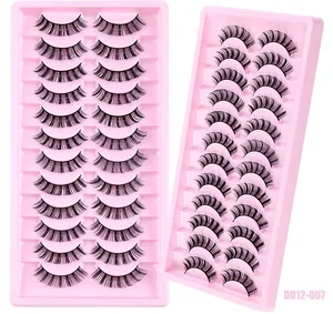 Close-up of 12 pairs of Russian D curl synthetic false eyelashes in pink plastic trays