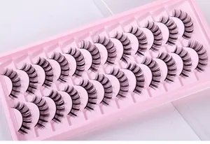 Detailed close-up of 10 pairs of Russian curl false eyelashes in pink plastic tray