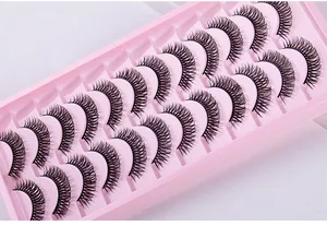 Detail of 10 pairs of Russian curly false eyelashes in a pink tray with criss-cross design