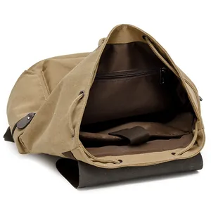 Khaki canvas backpack featuring a large interior with padded laptop sleeve and drawstring