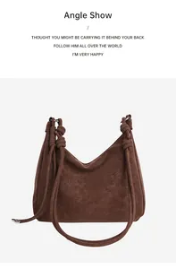 Detail view of brown vintage tote bag showing matte texture and knotted rope shoulder strap