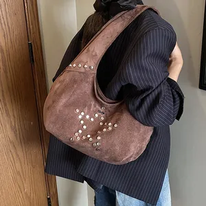 Brown suede hobo dumpling bag featuring vintage silver metal star stud decorations