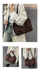 Dettaglio della borsa tote vintage in pelle scamosciata marrone con cinturini sottili