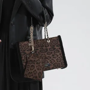 Leopard print tote bag with faux fur trim, gold chain handles and matching coin purse