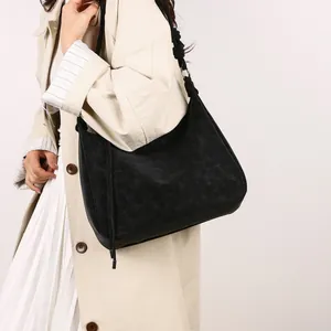 Vintage black faux suede tote bag with drawstring detail and metal ring strap