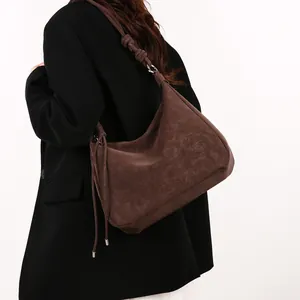Vintage large dark brown suede crossbody tote bag with decorative knot shoulder strap