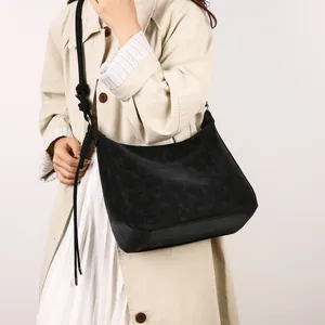 Retro black suede tote bag with large capacity and stylish decorative fringe knots