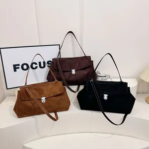 Minimalist vintage suede crossbody bags with metal lock in caramel, brown, and black colors