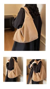 Detail of beige corduroy tote bag showing vertical rib texture and large capacity