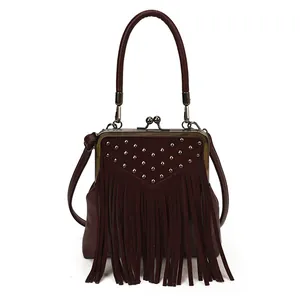Vintage burgundy fringe handbag with metallic studs and a versatile crossbody strap