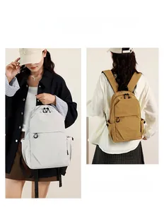 On-model view of mini waterproof nylon backpack in beige and khaki for daily commuting