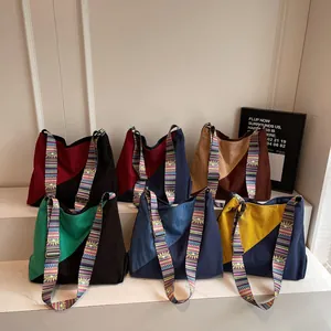 Patchwork corduroy shoulder bag with ethnic patterned strap in multiple color options