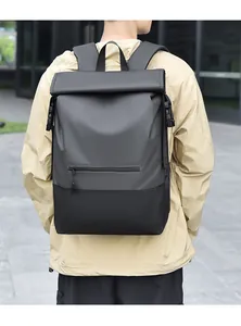 Detail of roll-top waterproof backpack with gray and black panels and buckle closure