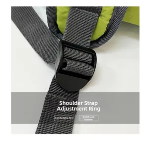 Detail of adjustable shoulder strap buckle on a green large capacity backpack