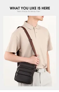 Close-up of a men's genuine leather shoulder bag with multiple zippered compartments