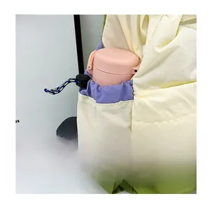 Detail of multi-color drawstring side pocket on lightweight student nylon backpack