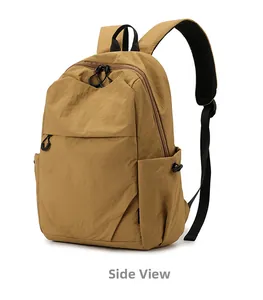 Side view of small khaki waterproof backpack showing durable fabric and zipper details