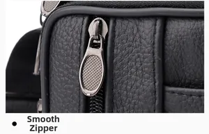 Detailaufnahme der Lychee-Lederstruktur und des glatten Metallreißverschlusses der Tasche