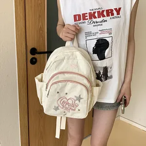 Mini sac à dos en velours côtelé blanc cassé avec broderies et fermeture éclair