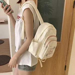 Mini sac à dos en velours côtelé blanc cassé pour femme avec poches zippées multiples