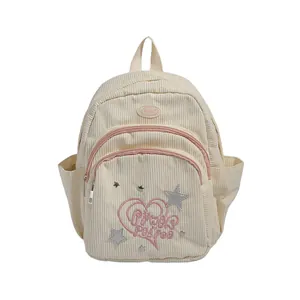 Mini sac à dos en velours côtelé crème avec broderie cœur rose et écusson étoile