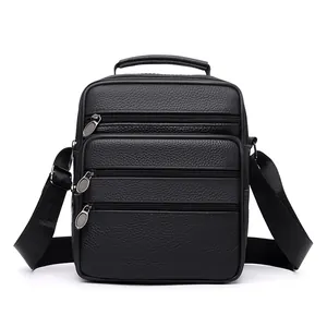 Classic black leather messenger bag with multiple zippers and adjustable shoulder strap