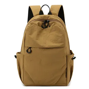 Brown lightweight nylon mini backpack with waterproof design and drawstring side pockets
