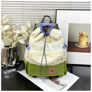 Detail of multi-color drawstring backpack with nylon fabric and side pockets for students