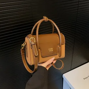 Two-tone retro PU leather crossbody bag with gold hardware and top handles