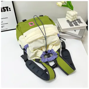 Detail of padded breathable honeycomb shoulder straps on a multicolor drawstring backpack