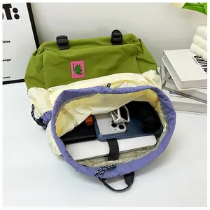 Detail view of large drawstring backpack interior showing ample space for laptops and daily essentials
